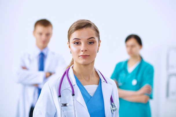 Woman doctor standing with stethoscope at hospital - Photo, image