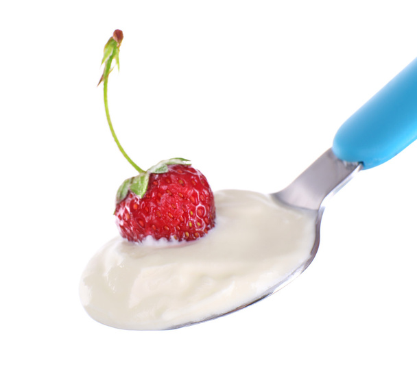 Delicious yogurt in spoon with strawberry isolated on white - Photo, Image