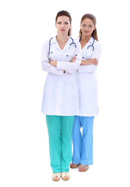 Two woman nurse watching X Ray image, standing in hospital - Valokuva, kuva