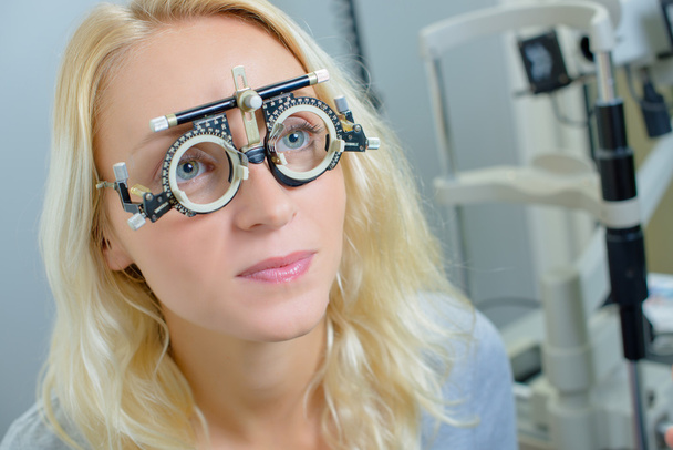 Lady wearing opticians testing glasses - Photo, image