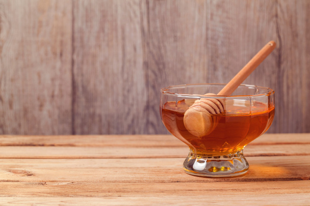 Honey on wooden background - Фото, изображение