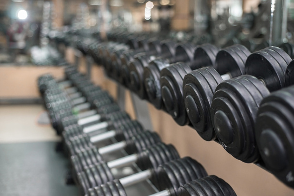 dumbbells on a background of the gym. - Photo, Image