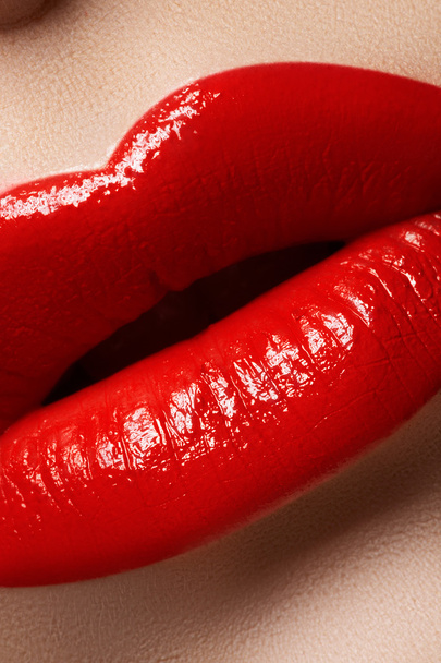 Close-up of woman's lips with bright fashion red makeup. Macro lips - Photo, image
