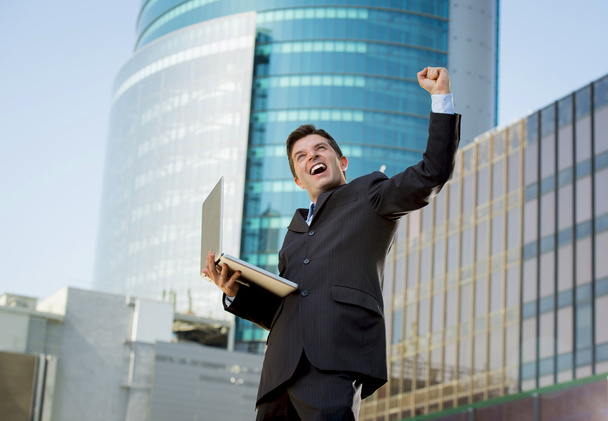successful businessman with computer laptop happy doing victory sign - Φωτογραφία, εικόνα