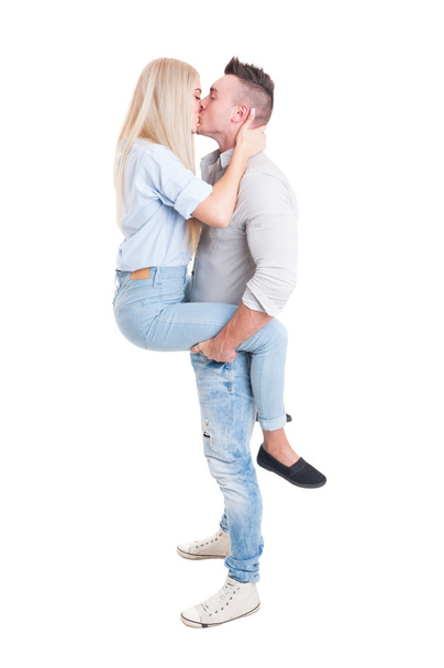 Man holding woman by legs with his strong arms - Photo, Image