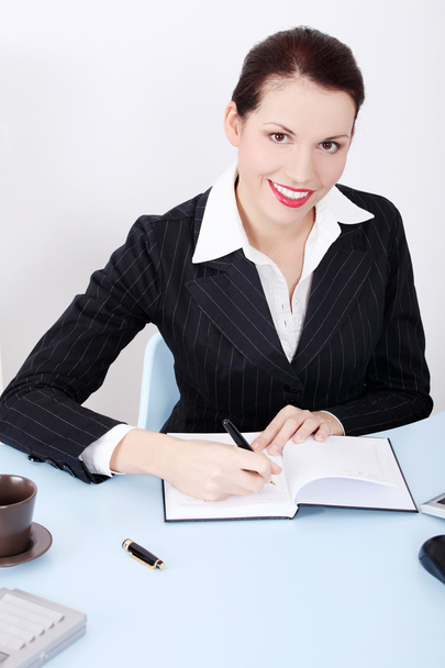 Writing businesswoman. - Фото, зображення