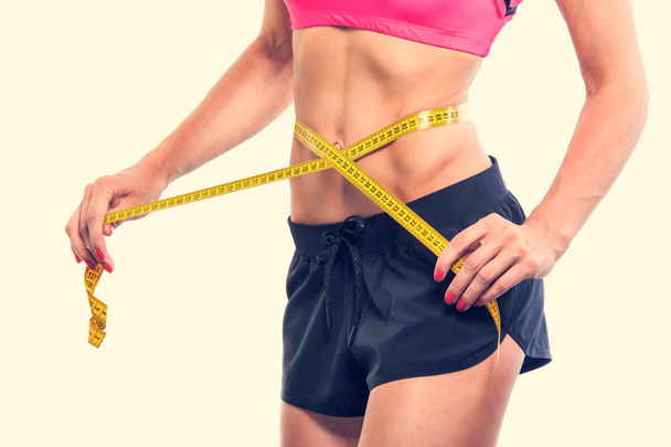 Weight losing - measuring womans body - Фото, изображение