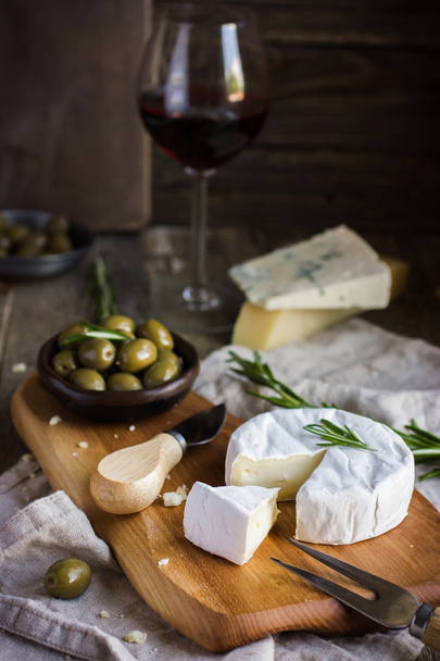 camembert cheese with rosemary and olives - Photo, image