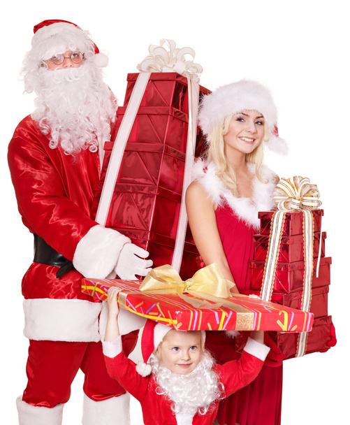 Weihnachtsmann Familie mit Kind hält Stapel Geschenkschachtel.. - Foto, Bild