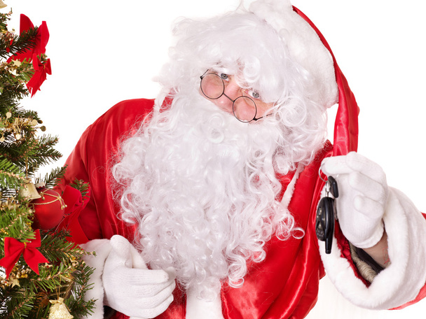 Santa Claus dando llaves automáticas
 . - Foto, Imagen