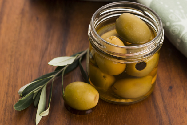 pickled olives and olive tree branch - Photo, Image