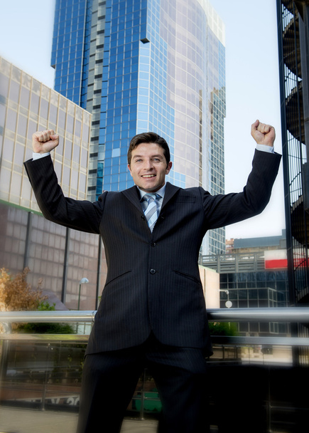 successful businessman excited and happy doing arm winner sign - Fotografie, Obrázek