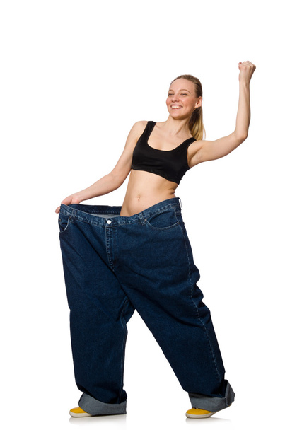 Dieting concept with big jeans on white - Фото, изображение