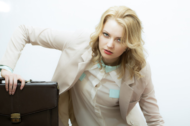 Tired business woman with briefcase - 写真・画像