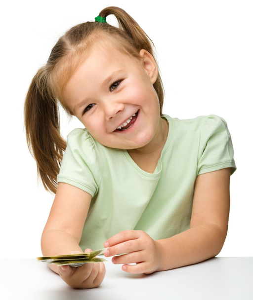 Cute little girl with paper money - dollars - Photo, Image