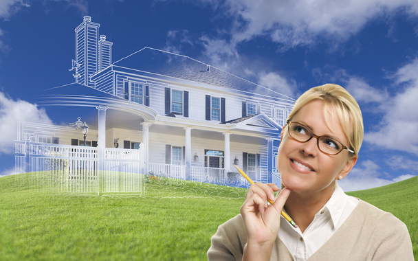 Smiling Woman Holding Pencil Looking to Ghosted House Drawing Be - Photo, Image