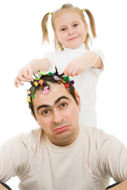 Daughter of braids cornrows his father on a white background. - 写真・画像