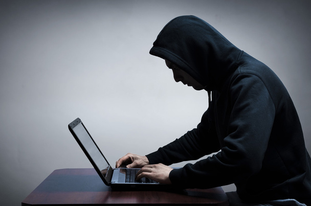 Hacker stealing data from computer  - 写真・画像