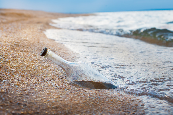 Sealed bottle on shore - Photo, Image