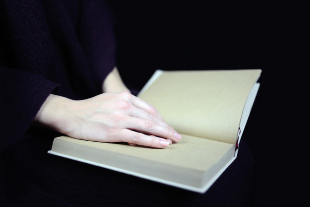 female hands on a closed book - Photo, Image