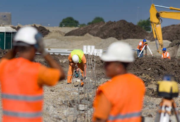 Trabajadores de la construcción en obra
 - Foto, Imagen