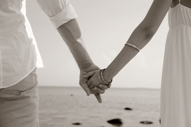 Young couple holding hands - Photo, Image
