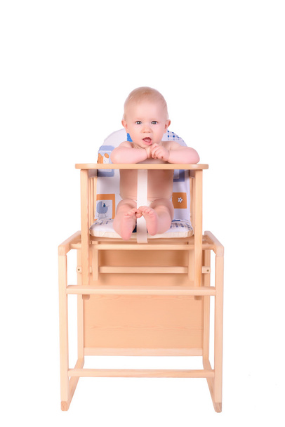 Adorable baby in high chair isolated - Foto, Bild