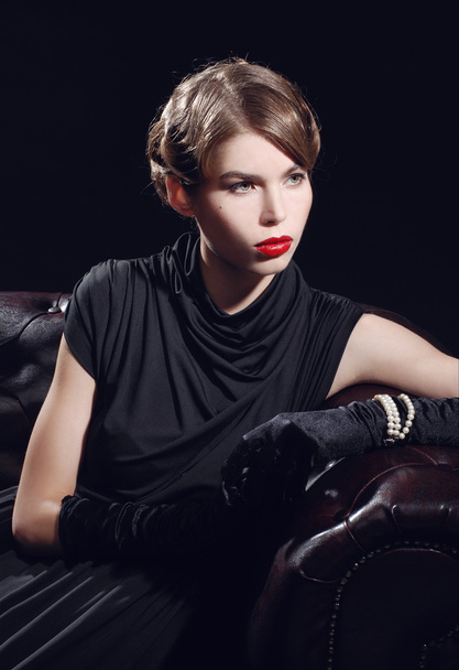 Young beautiful woman in black dress - Valokuva, kuva