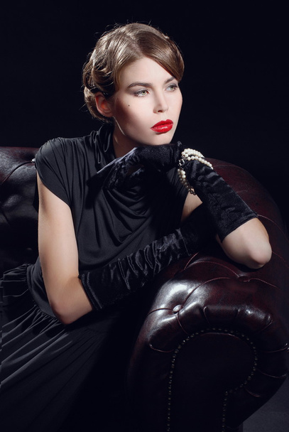 Young beautiful woman in black dress - Foto, Imagen