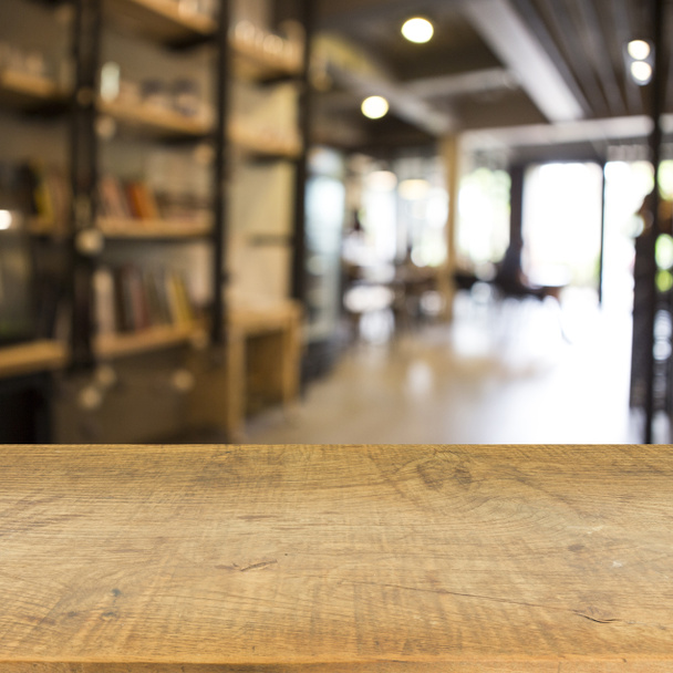 Café en hout vloer textuur achtergrond wazig - Foto, afbeelding
