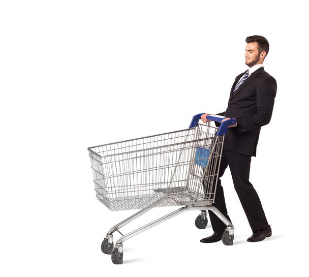 Businessman with shopping cart - 写真・画像