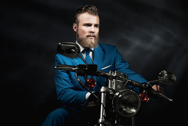 Handsome businessman on a motorbike - Fotó, kép