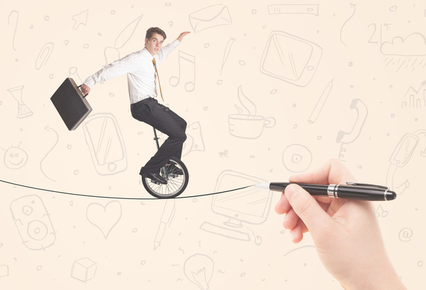 Businessman riding monocycle on a rope drawn by hand - Photo, Image