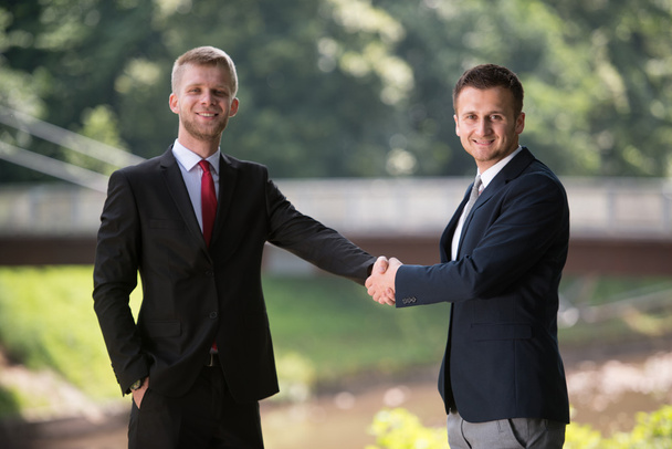 Two Businessman Shaking Hands Greeting Each Other - Fotografie, Obrázek