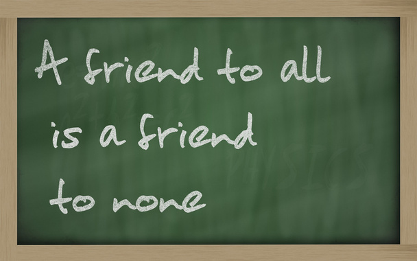 " A friend to all is a friend to none " written on a blackboard - Photo, Image