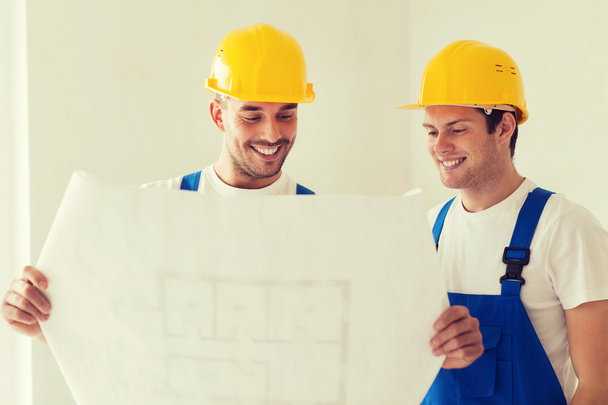 group of builders with blueprint - Photo, Image