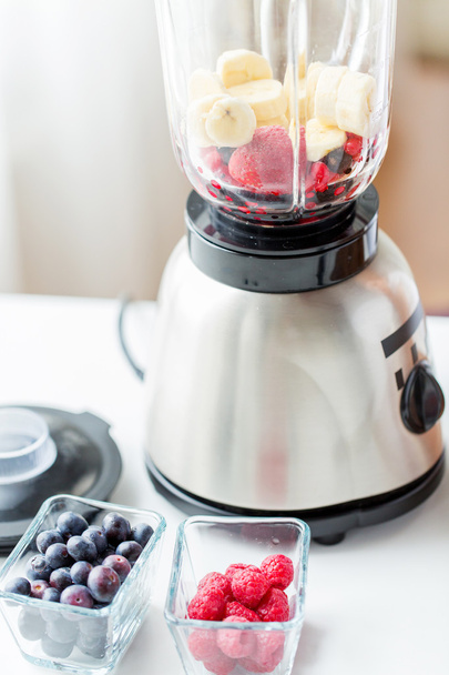 close up of blender with berries and fruits - Foto, Imagen