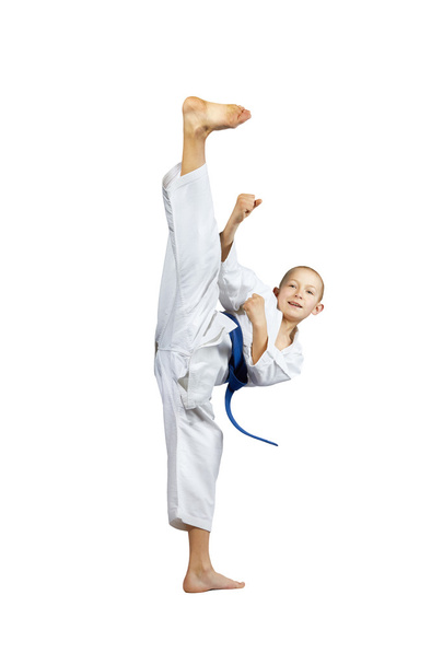 Vuonna karategi urheilija voittaa potkia mavashi geri
 - Valokuva, kuva