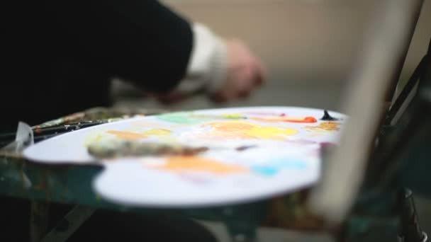Senior artist draws a picture paints. Sequence 3 shot - Video