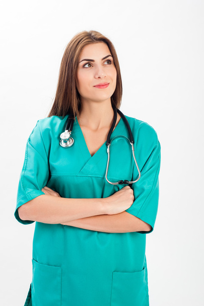 Woman in medical doctor uniform and stethoscope - Фото, изображение