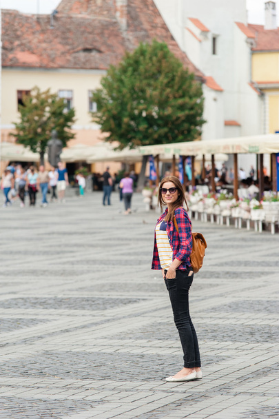 Young attractive woman traveling, visiting the medieval city. - Fotó, kép