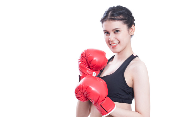 Fitness woman with the red boxing gloves. - 写真・画像