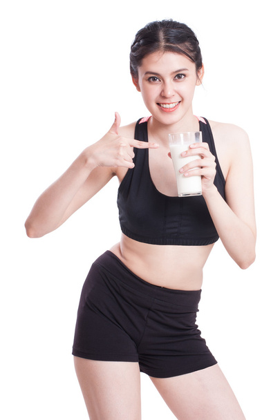 Beautiful healthy woman holding glass of milk - Photo, Image