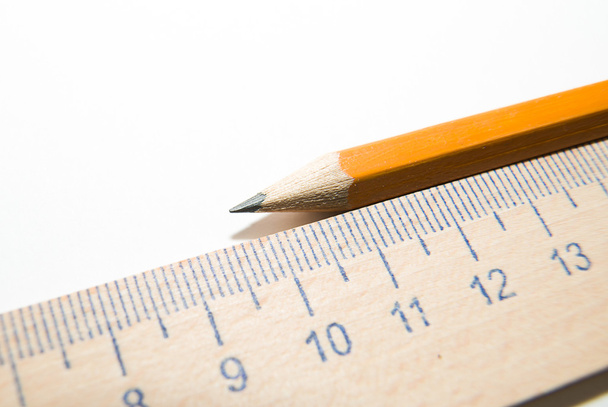 Блокноты, карандаш и деревянная линейка на белом фоне
 - Фото, изображение