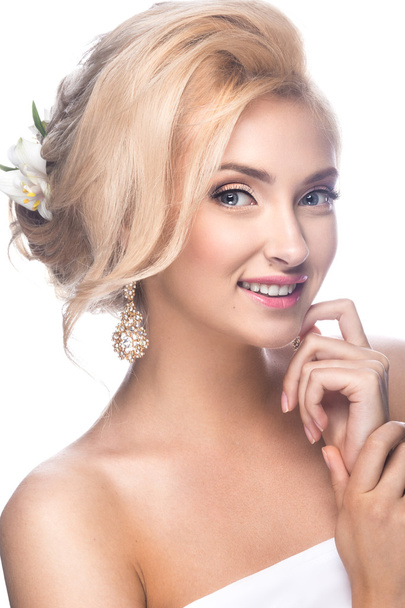 Beautiful blond girl in the image of a bride with flowers. Beauty face. Wedding image. - Foto, imagen