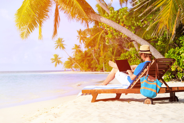 man with laptop on tropical beach - Photo, Image
