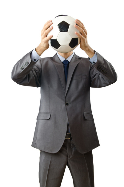 Businessman holding football on white - Photo, image