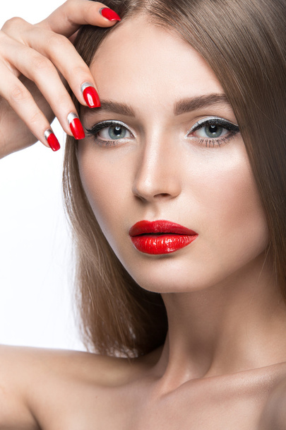 Beautiful young girl with a bright make-up and red nails. Beauty face. - Fotografie, Obrázek