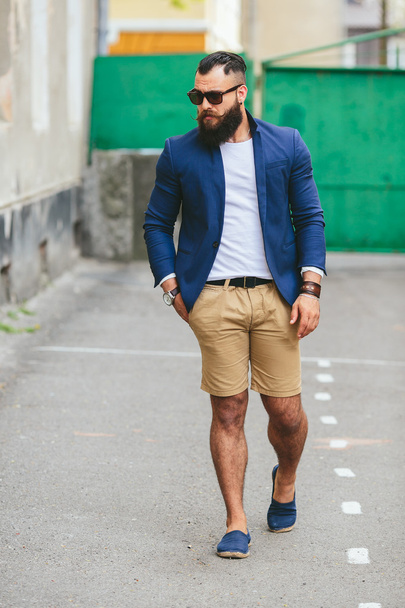 Stylish bearded man walks through the city - Φωτογραφία, εικόνα