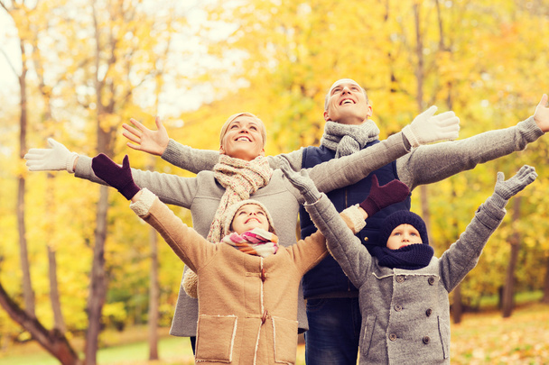 happy family having fun in autumn park - Foto, imagen